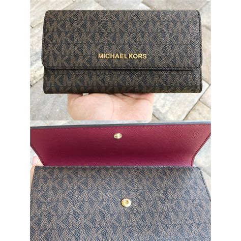 michael kors wallet trav|Michael Kors large trifold wallet.